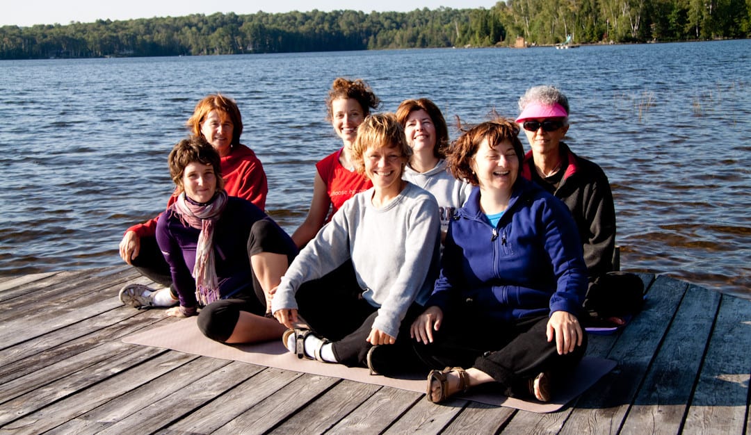 Wendy with a group of yogis on the dock